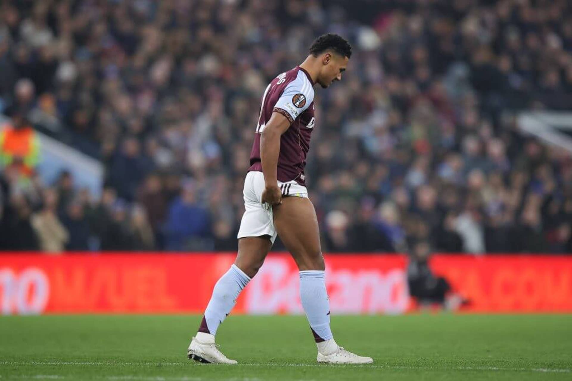 Ollie Watkins holds the back of his right leg as he leaves the pitch injured in the first half of Aston Villa's 3-2 win over RB Salzburg on Thursday.