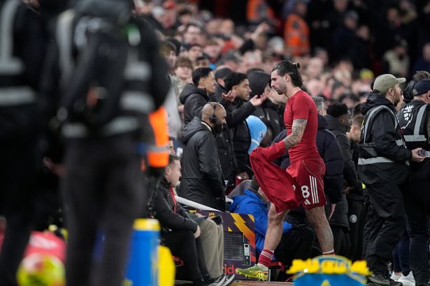 Dominik Szoboszlai walks down the tunnel after being sent-off vs Man City