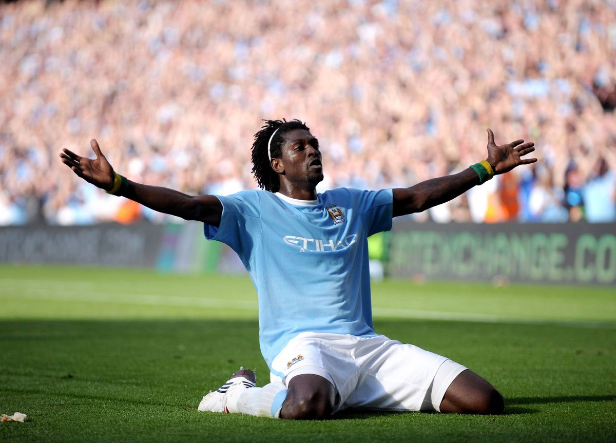 Emmanuel Adebayor of Manchester City celebrates in front of the Arsenal fans after scoring during the Barclays Premier League match between Manchester City and Arsenal