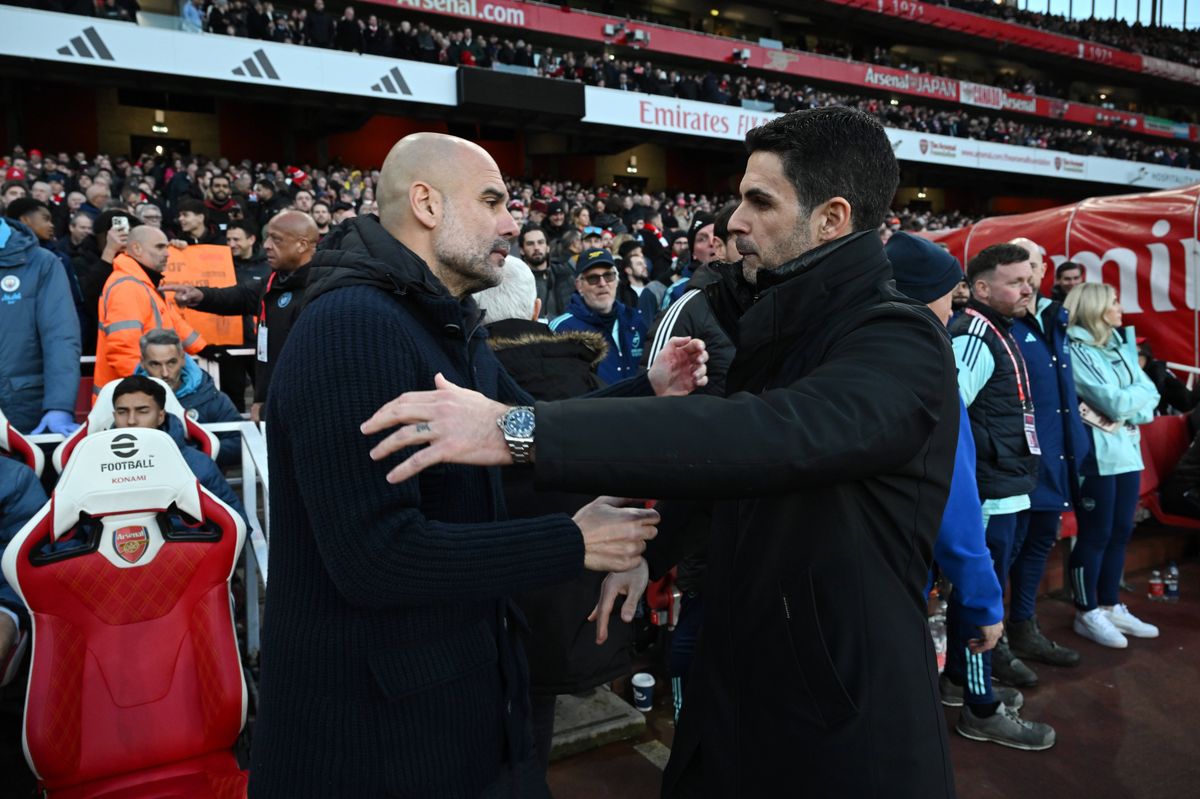 LONDON, ENGLAND - FEBRUARY 02: Pep Guardiola, Manager of Manchester City, embraces Mikel Arteta, Manager of Arsenal, prior to the Premier League match between Arsenal FC and Manchester City FC at Emirates Stadium on February 02, 2025 in London, England. (Photo by David Price/Arsenal FC via Getty Images)