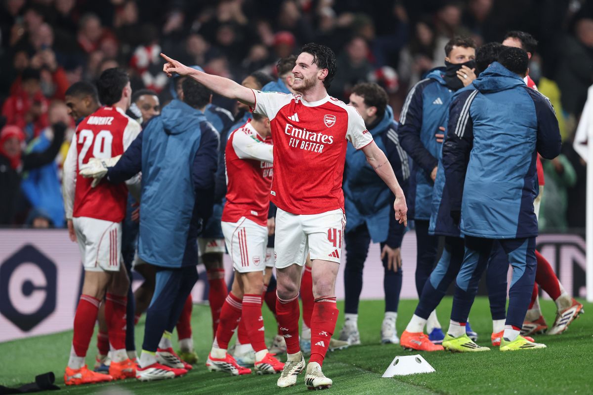 Arsenal players celebrate a goal against Chelsea