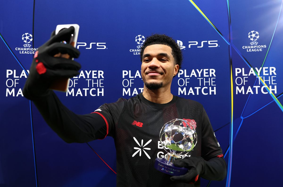 Malik Tillman of Bayer 04 Leverkusen takes a selfie using a mobile phone with his PlayStation Player Of The Match award after the UEFA Champions League 2025/26 League Phase MD8 match between Bayer 04 Leverkusen and Villarreal CF at BayArena on January 28, 2026 in Leverkusen, Germany. 