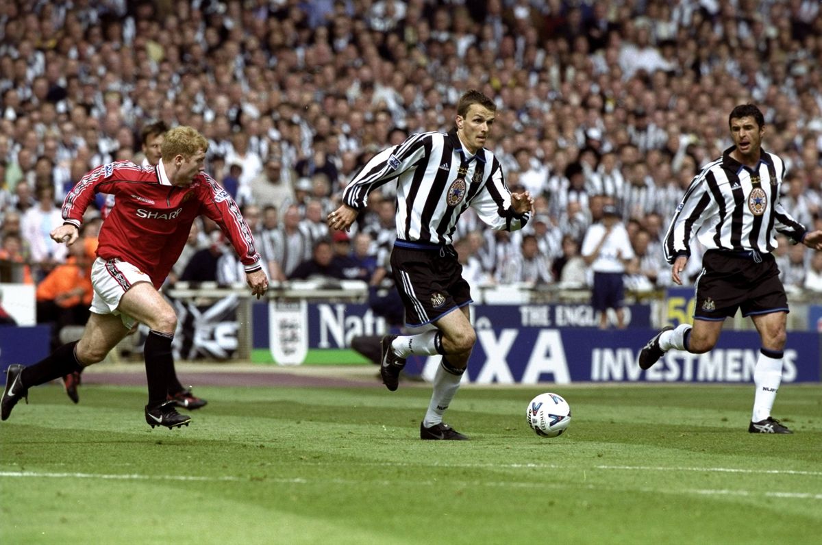 Dietmar Hamann of Newcastle United in action against Paul Scholes of Manchester United during the AXA FA Cup Final match against Manchester United played at Wembley Stadium in London, England. 