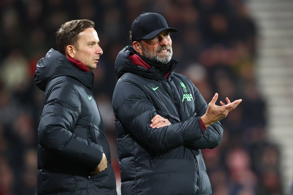Pep Lijnders and Jurgen Klopp stand on the touchline for Liverpool