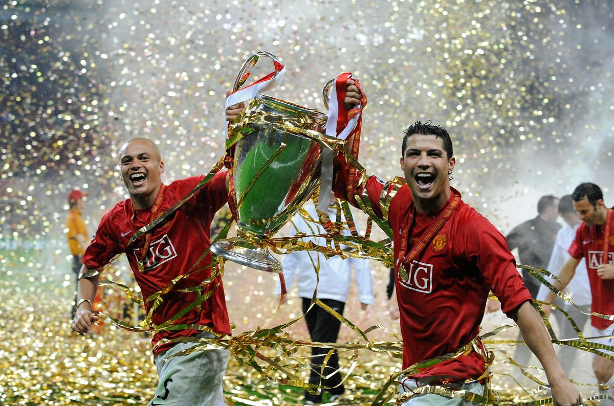 Manchester United players Wes Brown (left) and Cristiano Ronaldo (right) parade the trophy following the UEFA Champions League Final against Chelsea at the Luzhniki Stadium on May 21st 2008 in Moscow, Russia (Photo by Tom Jenkins/Getty Images)