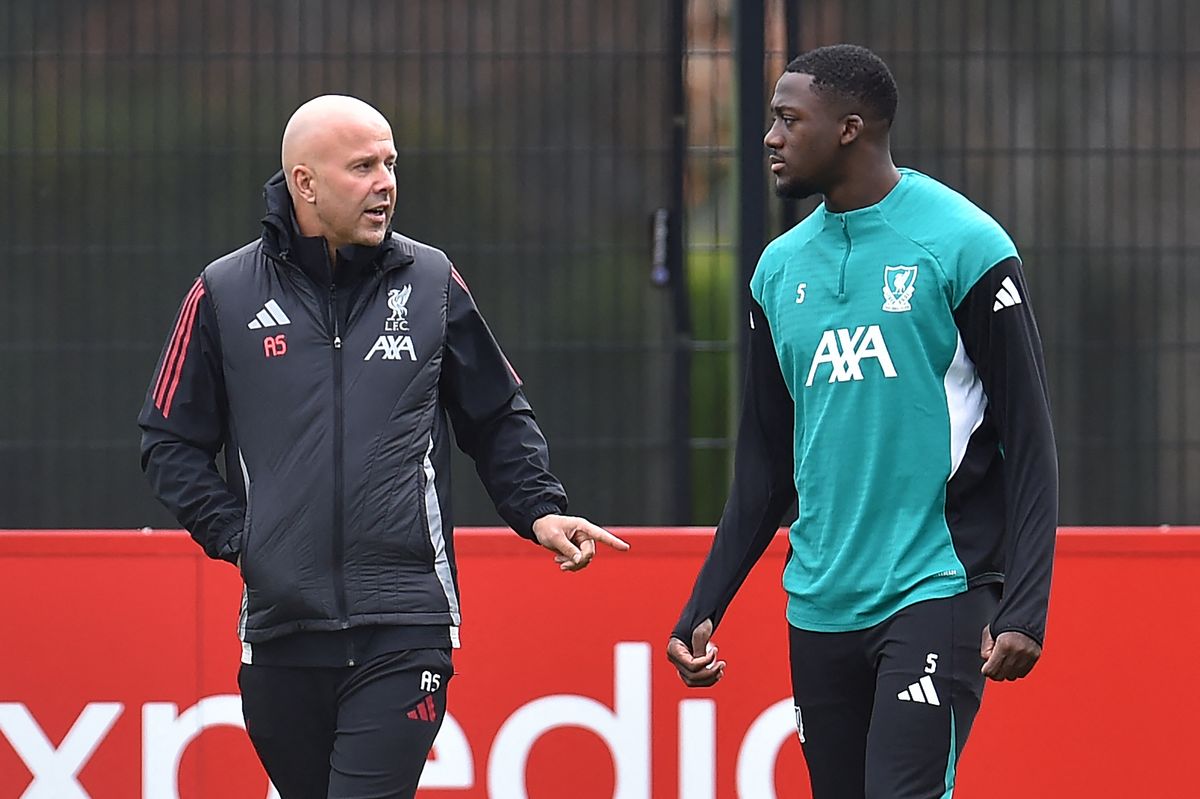 Liverpool's Dutch manager Arne Slot (L) speaks with Liverpool's French defender #05 Ibrahima Konate (R) during a training session at the team's training ground in Kirkby, north of Liverpool in north-west England, on November 3, 2025, on the eve of their UEFA Champions League league phase football match against Real Madrid. (Photo by PETER POWELL / AFP) (Photo by PETER POWELL/AFP via Getty Images)