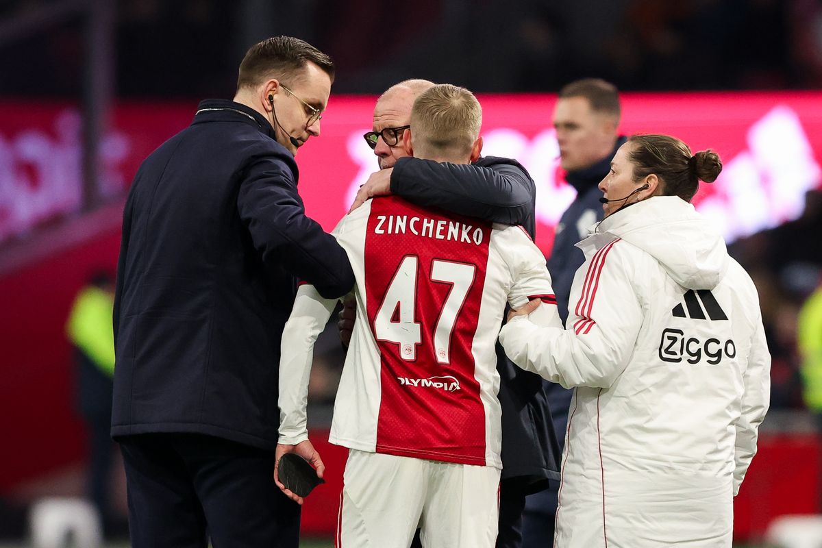 AMSTERDAM, NETHERLANDS - FEBRUARY 14: Headcoach Fred Grim of AFC Ajax hugs Oleksandr Zinchenko of AFC Ajax during the Dutch Eredivisie match between AFC Ajax and Fortuna Sittard at Johan Cruijff ArenA on February 14, 2026 in Amsterdam, Netherlands. (Photo by Hans van der Valk/BSR Agency/Getty Images)