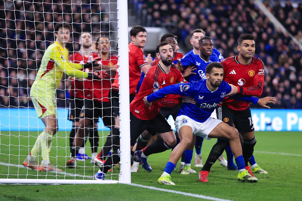 Iliman Ndiaye holds back Bruno Fernandes ahead of an Everton corner against Manchester United