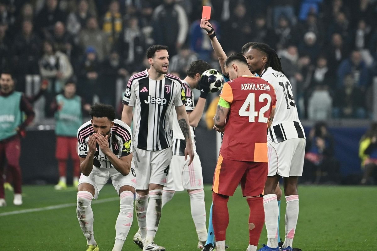 Portuguese referee Joao Pinheiro shows a red card to Juventus defender Lloyd Kelly during the UEFA Champions League knockout round play-off second leg against Galatasaray in Turin on February 25 2026