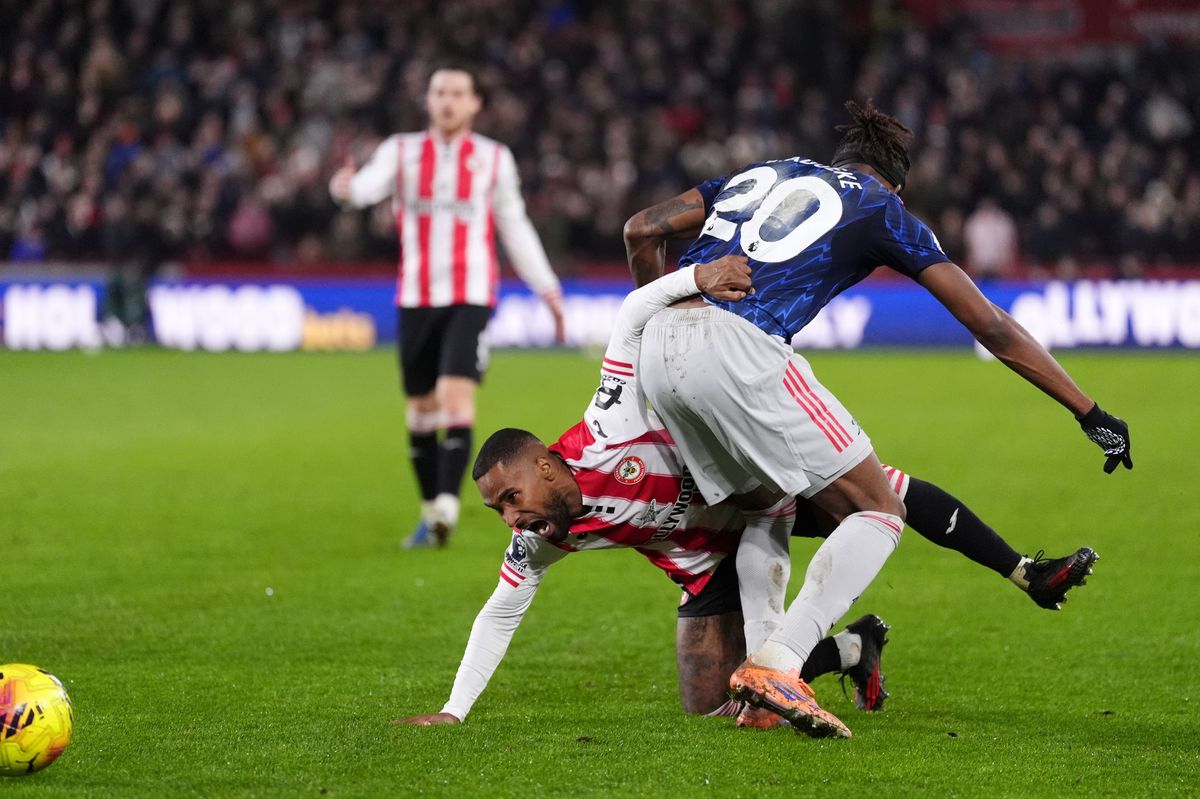 Brentford's Rico Henry and Arsenal's Noni Madueke