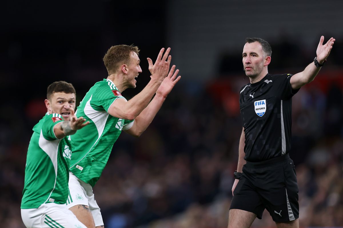 Kieran Trippier and Dan Burn of Newcastle react after Chris Kavanagh failed to award a penalty during the FA Cup match with Aston Villa