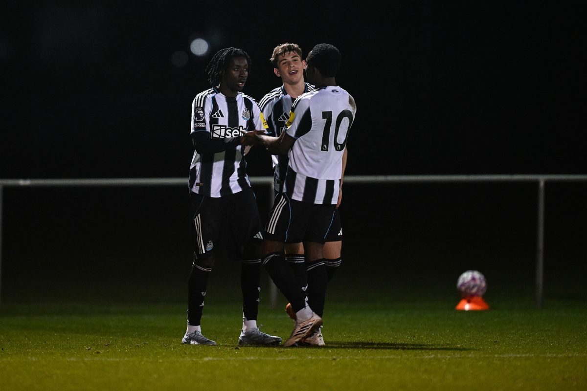 Michael Mills of Newcastle United (L) celebrates with team-mates Mason Miley and Anthony Munda