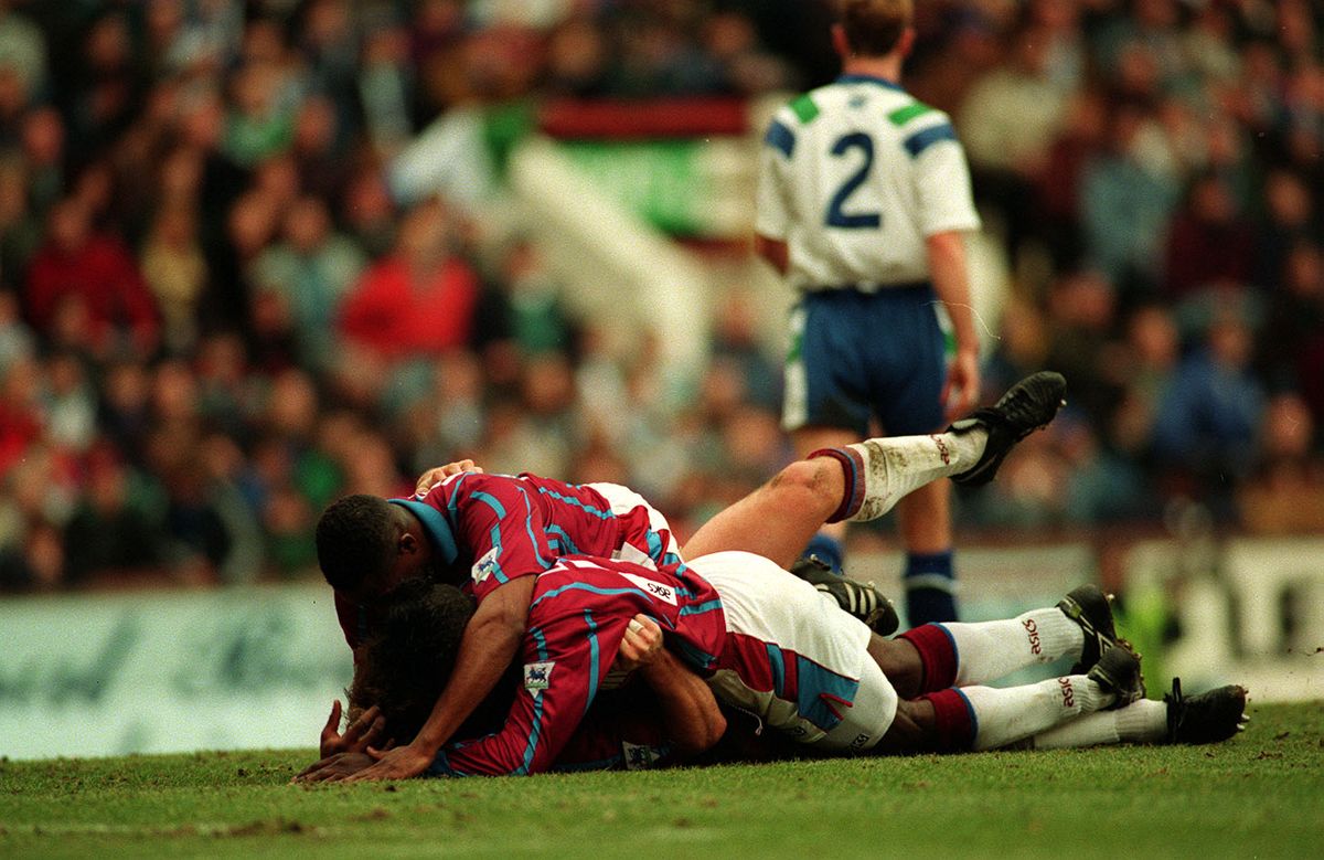 Dalian Atkinson, Tony Daley and Shaun Teale celebrate after beating Tranmere Rovers in 1994