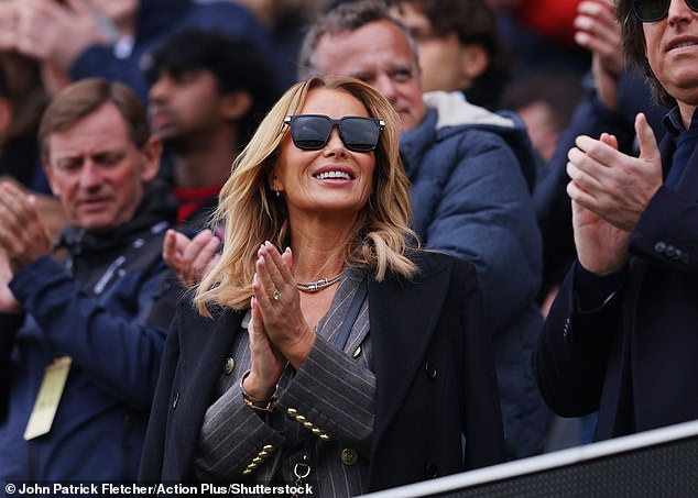 Amanda looked as glamorous as ever in a grey pinstriped, three-piece suit, consisting of a waistcoat and a double breasted blazer with trousers