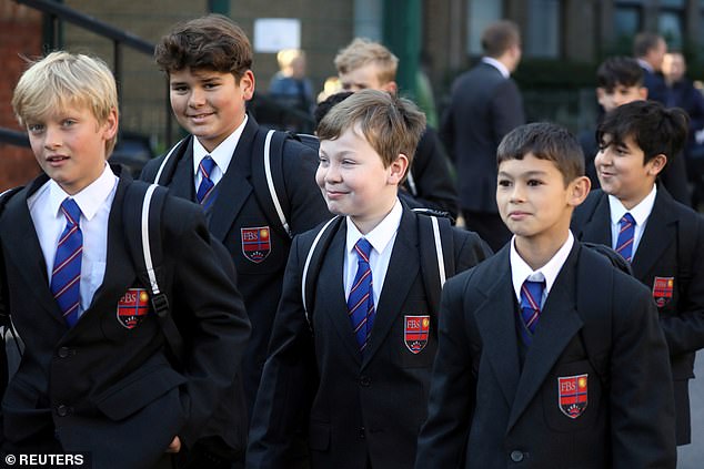 Under Mr Smith's leadership, the Fulham Boys School only allows pupils to bring a 'brick' phone - a device not connected to the Internet. (File image: Pupils from The Fulham Boys School are pictured in 2020)