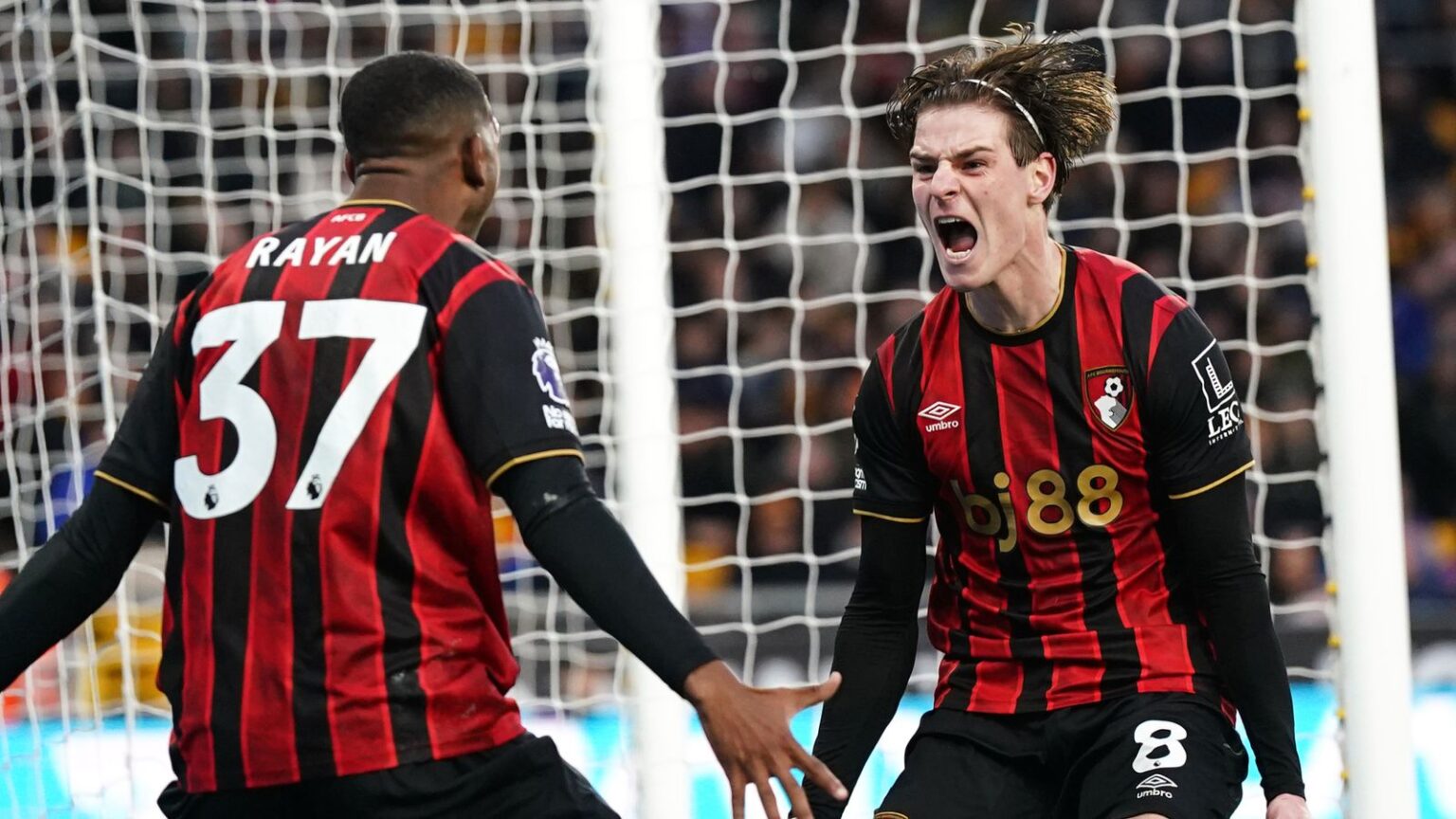 Alex Scott celebrates after doubling Bournemouth's lead