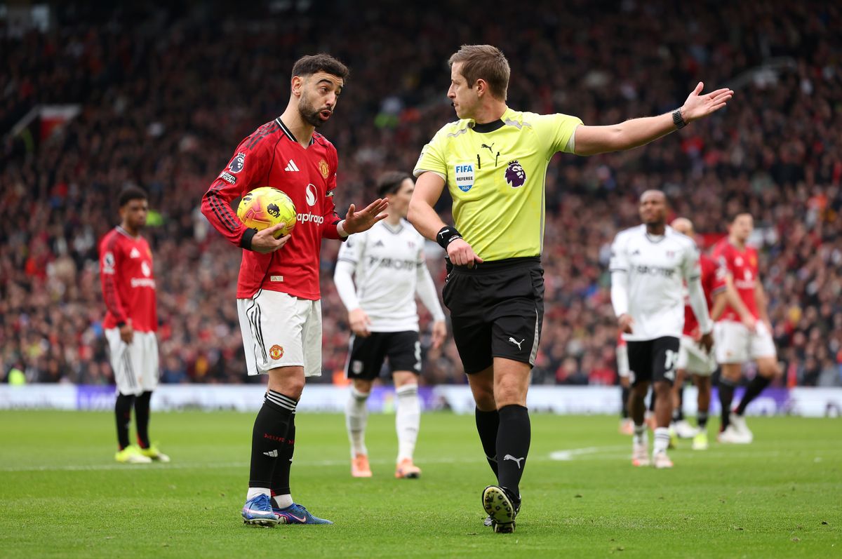  Bruno Fernandes of Manchester United appeals to Referee John Brooks after overturning his decision following a VAR review