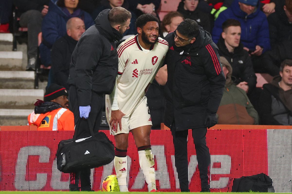 Joe Gomez of Liverpool goes off injured during the Premier League match between Bournemouth and Liverpool