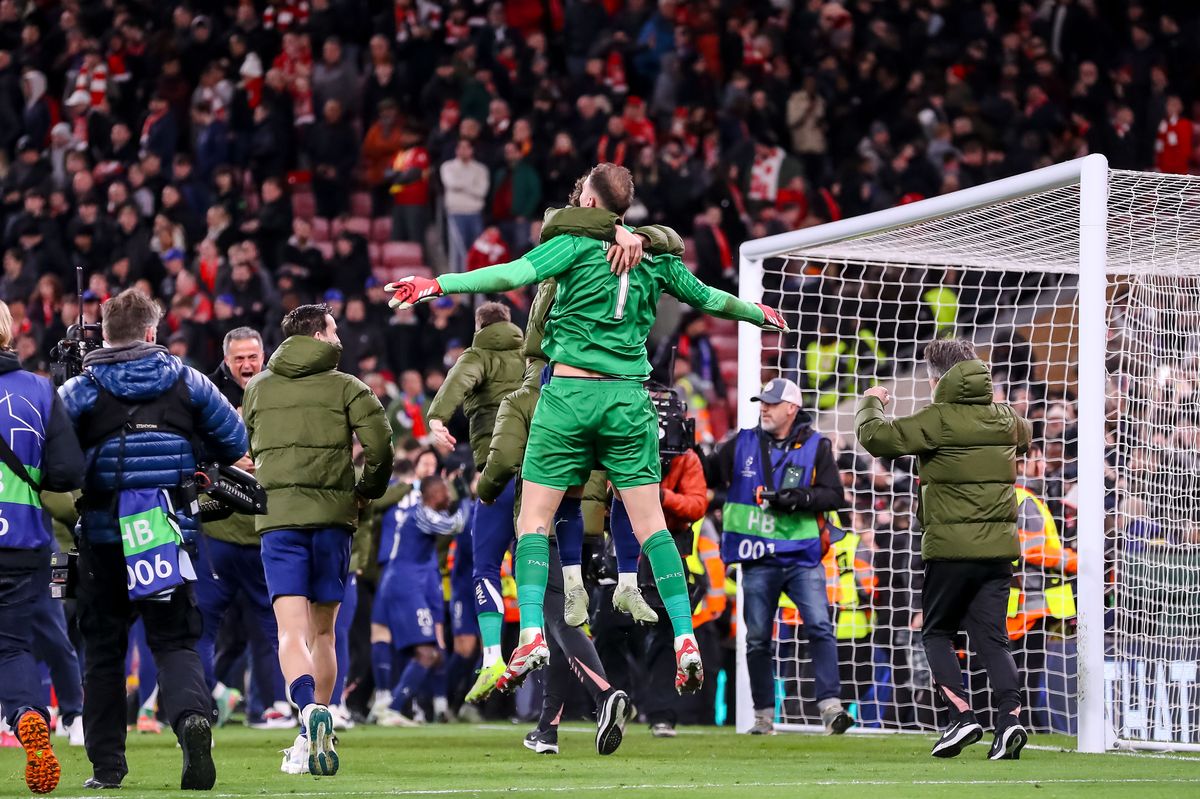 goalkeeper Gianluigi Donnarumma of PSG celebrates after winning the UEFA Champions League 2024/25 Round of 16 Second Leg match between Liverpool FC and Paris Saint-Germain at Anfield on March 11, 2025 in Liverpool, England