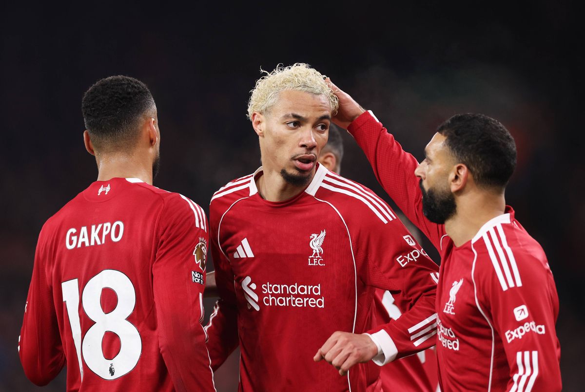 Hugo Ekitike celebrates scoring his team's second goal with teammate Mohamed Salah during the Premier League match between Liverpool and Newcastle United. 