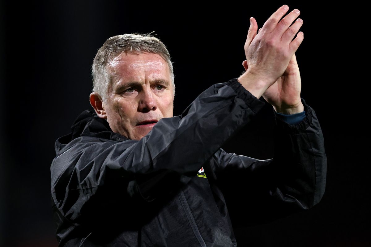 Phil Parkinson, Manager of Wrexham, claps the fans during the Emirates FA Cup Fourth Round match between Wrexham and Ipswich Town on February 13, 2026 in Wrexham, Wales.