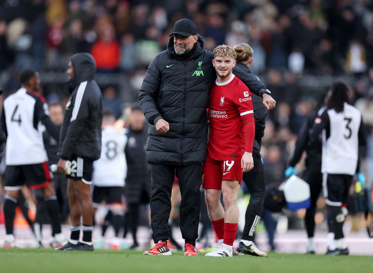 Jurgen Klopp, Manager of Liverpool, embraces Harvey Elliott of Liverpool after the team's victory in the Premier League match between Fulham FC and Liverpool FC at Craven Cottage on April 21, 2024 in London, England.