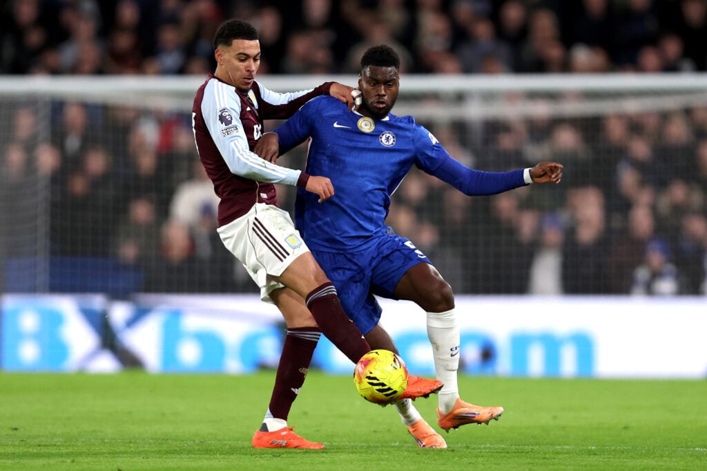 Benoit Badiashile of Chelsea battles for possession with Morgan Rogers of Aston Villa