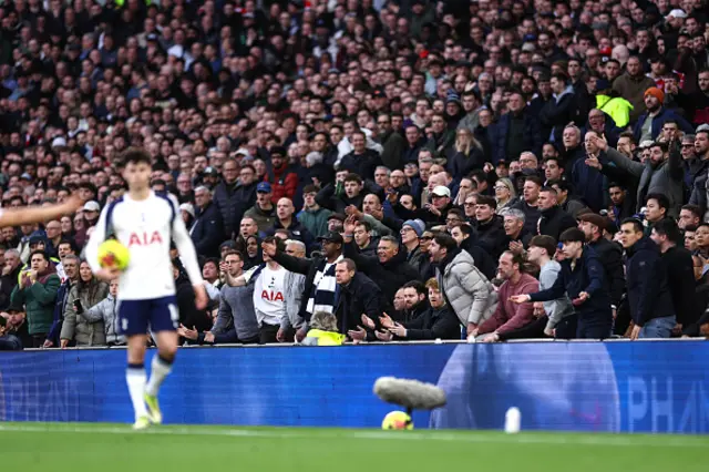 Tottenham fans gesture and shout