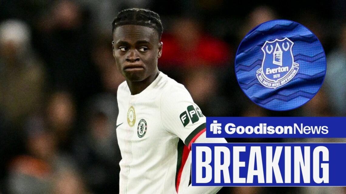 Tyrique George looking towards circular inset of Everton badge