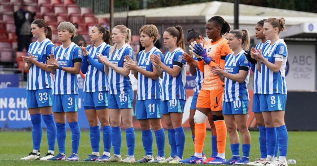 Chris Roberts stands with Dario Vidosic at Brighton