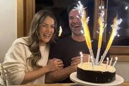 Gethin Jones and Pien Meulensteen smiling next to a birthday cake