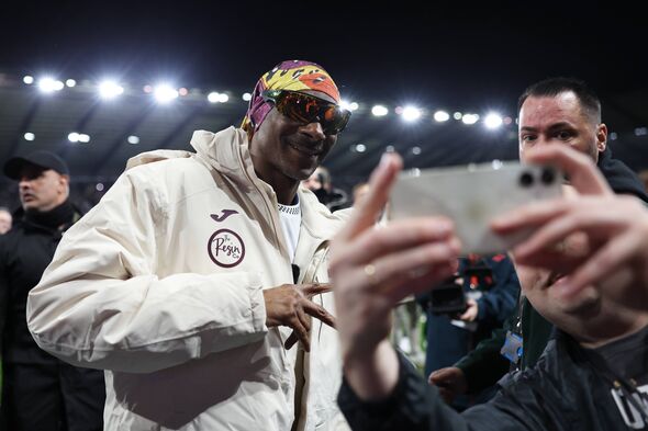 Snoop Dogg poses for a picture