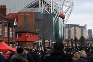 Fans walk toward Old Trafford