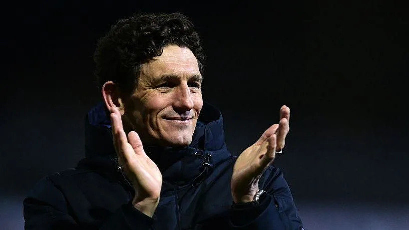 Keith Andrews applauds the fans