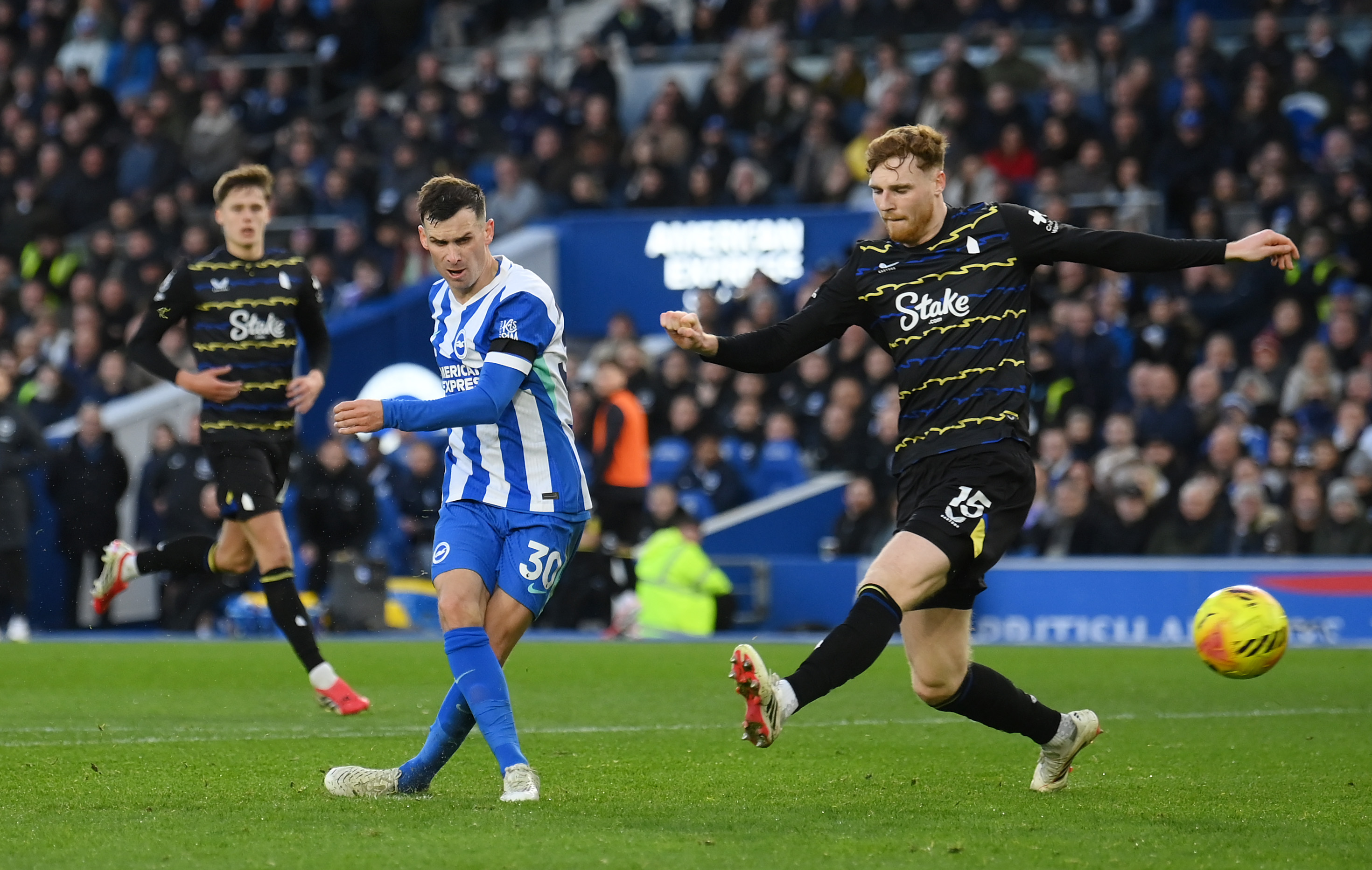 Pascal Gross of Brighton & Hove Albion scores a goal against Jake O'Brien of Everton.
