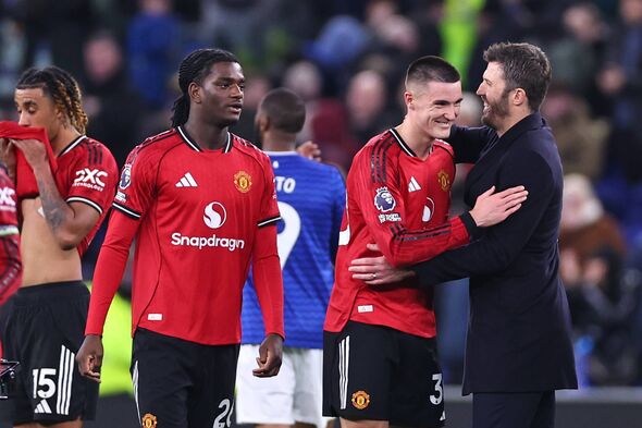 Manchester United head coach / manager Michael Carrick celebrates at full time with Benjamin Sesko of Manchester United during t