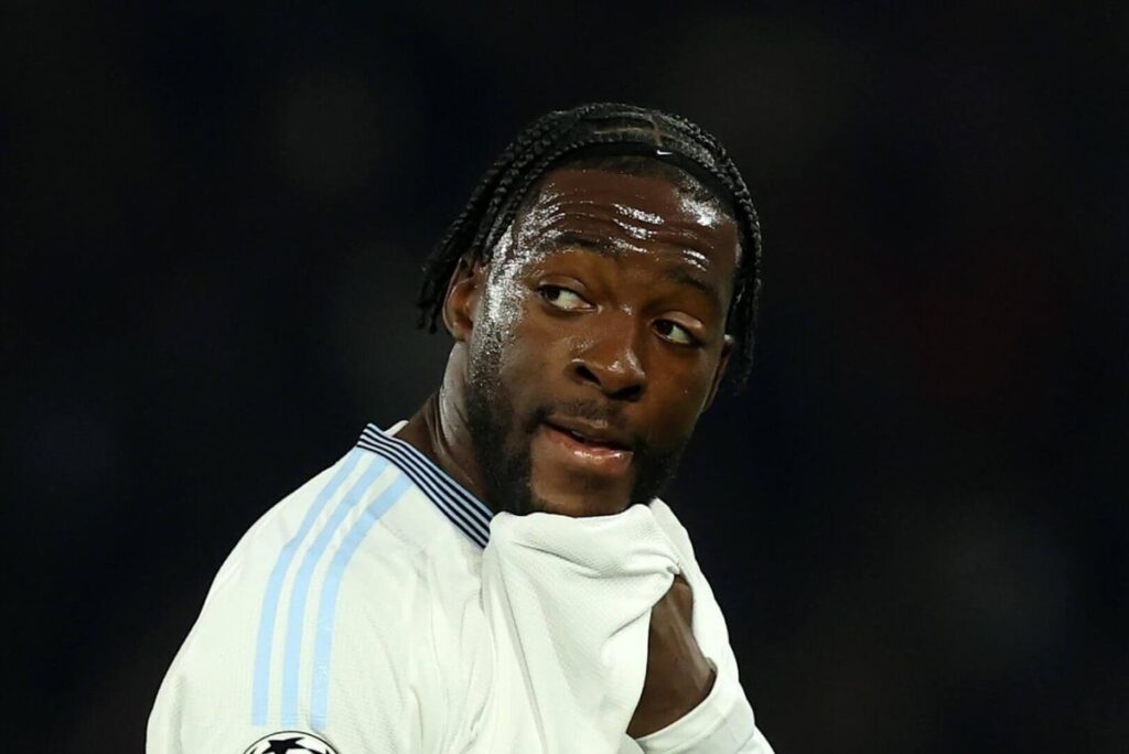 Axel Disasi wiping his face with his shirt