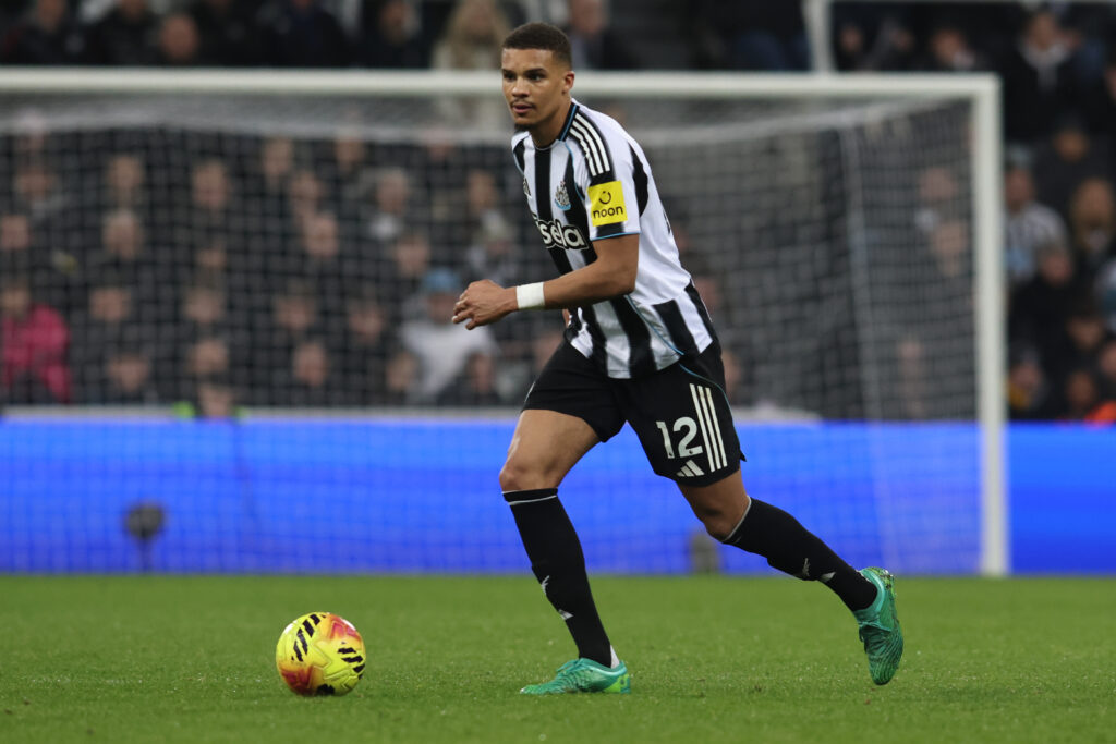 Malick Thiaw runs with the ball during Newcastle United's Premier League game with Brentford.