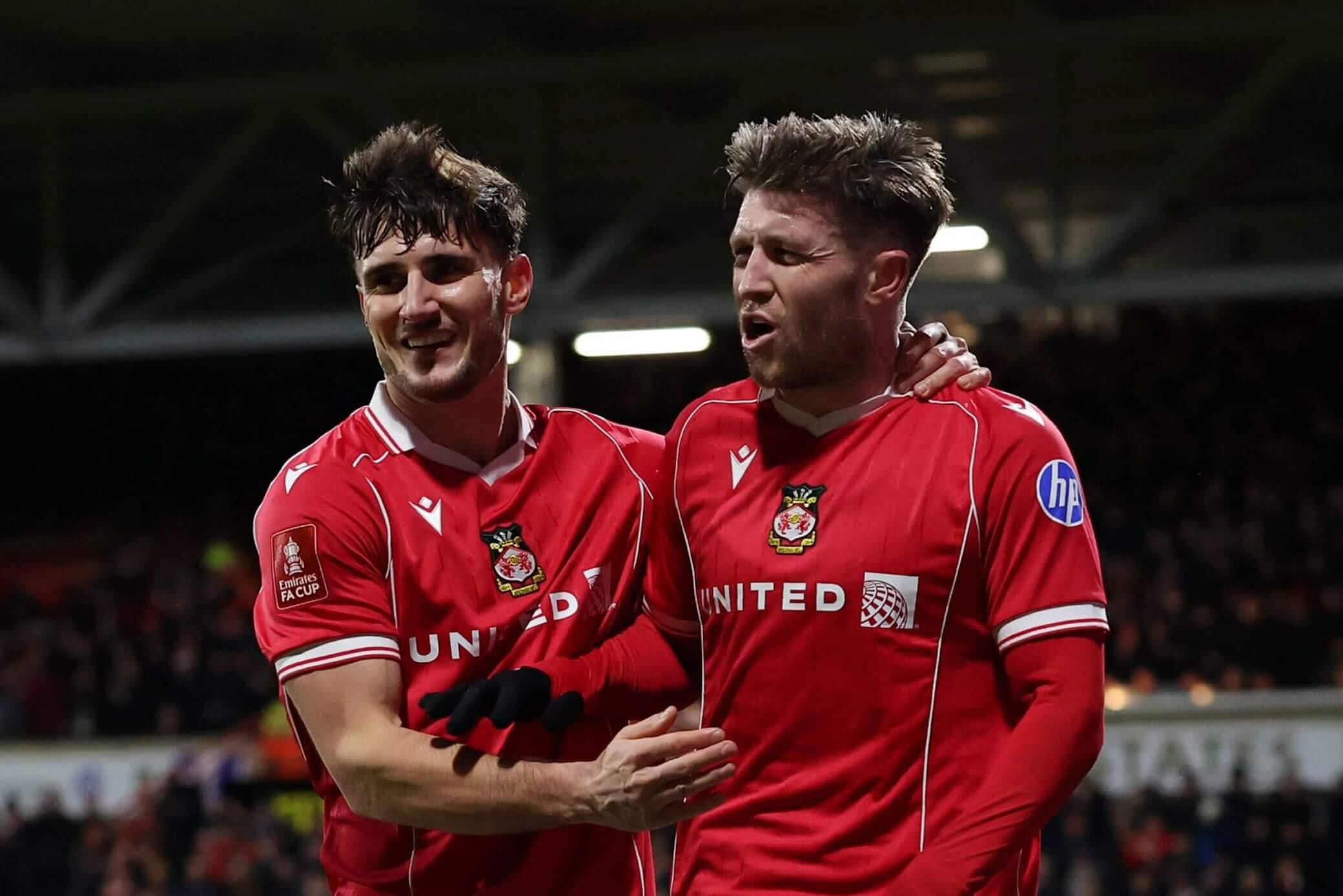 Wrexham players celebrate Josh Windass' goal against Ipswich Town