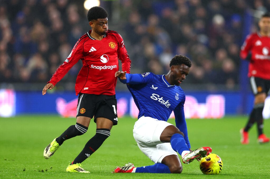 Tim Iroegbunam in action with Amad Diallo during the Premier League match between Everton and Manchester United at the Hill Dickinson Stadium in 2026 in Liverpool, England.
