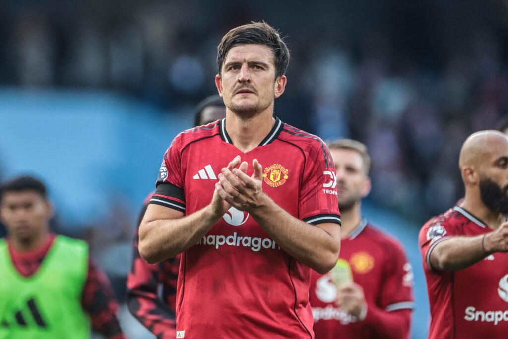 Harry Maguire clapping in a Man United shirt