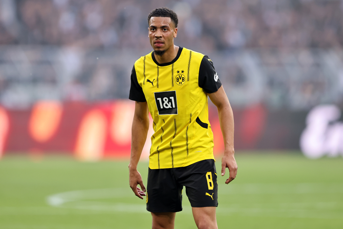 Felix Nmecha looks on while in action for Dortmund.
