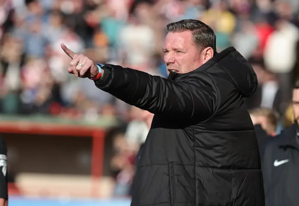 Northampton manager Kevin Nolan points during a game