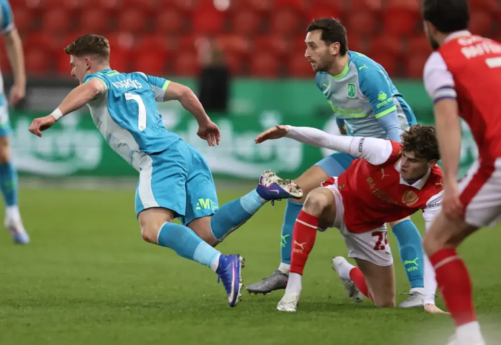 Harry Gray challenges for the ball while playing for Rotherham United