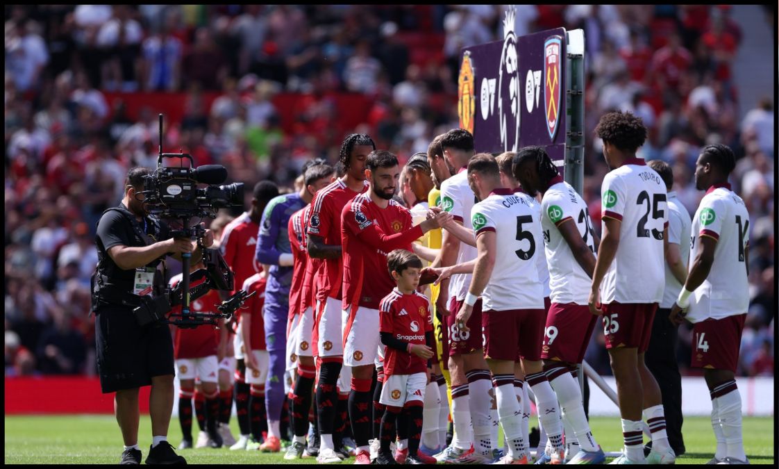 Manchester United and West Ham’s players shake hands prior to kick-off at Old Trafford.