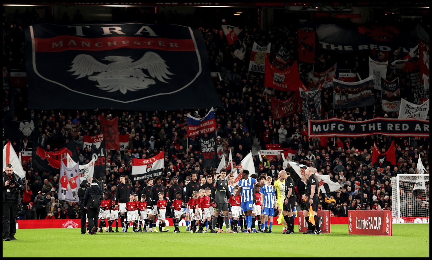 Man United and Brighton players walk out at Old Trafford.