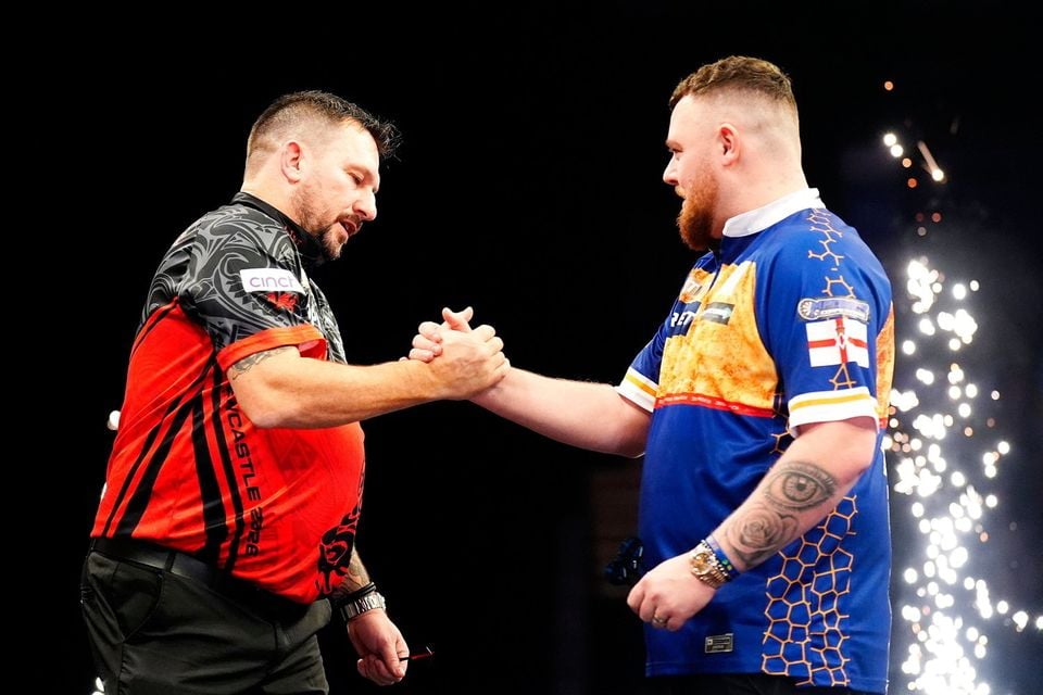 Northern Ireland's Josh Rock (right) was beaten by Jonny Clayton in his Premier League debut in Newcastle