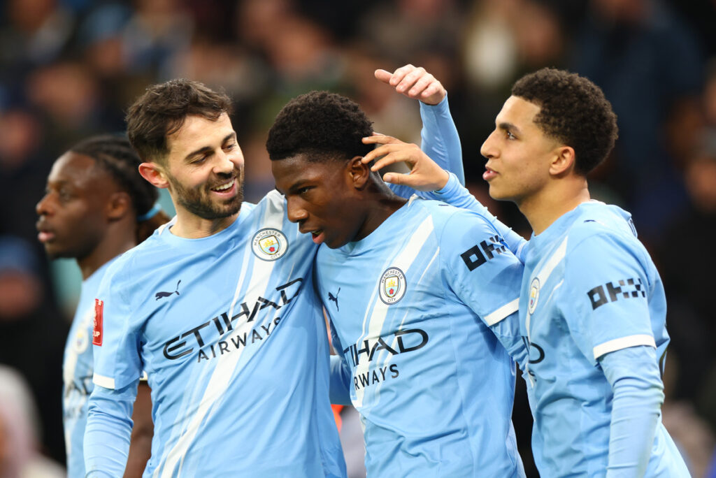 Bernardo Silva celebrates with Man City teammates