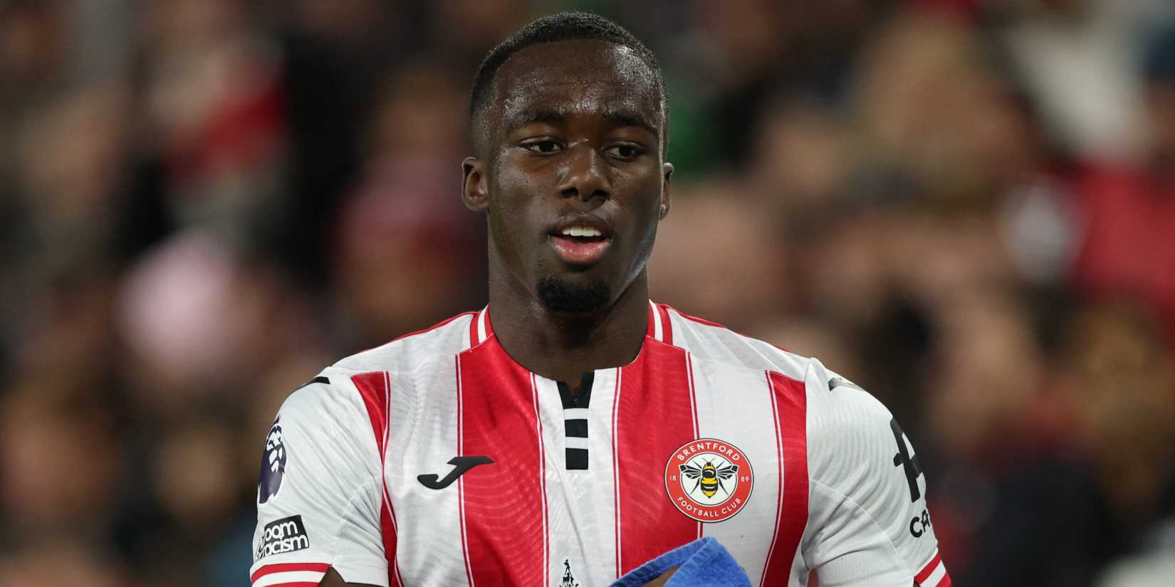 Brentford's Michael Kayode with a towel