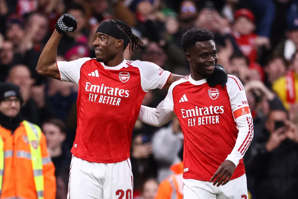 Noni Madueke and Bukayo Saka celebrate during Arsenal's win over Wigan